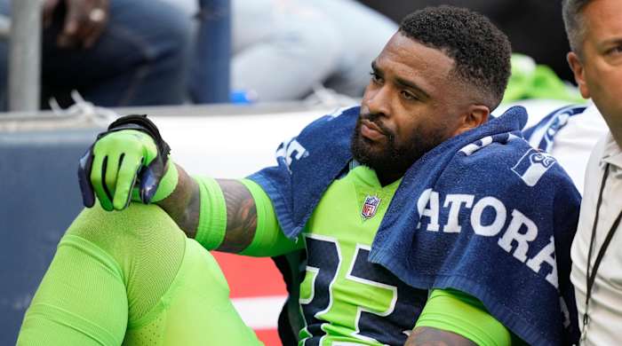 Seahawks safety Jamal Adams is taken off the field on a cart after an injury during the first half of a game against the Broncos.